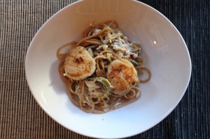 spicy scallops on pasta with fiddlehead ferns